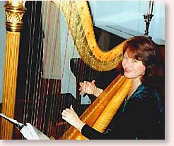 Sally playing Christmas Carols on the harp